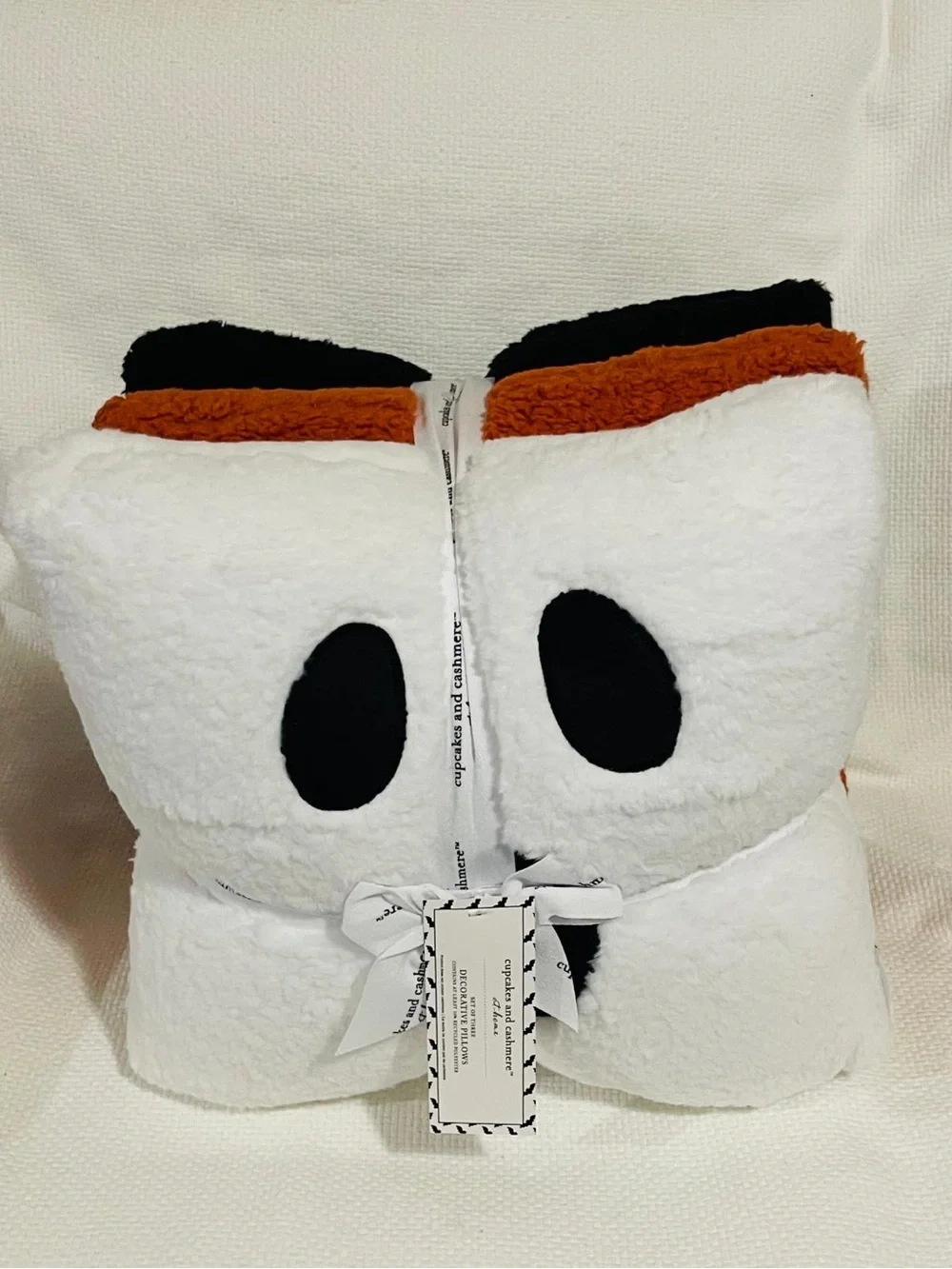 cupcakes & cashmere White Plush Throw with Black & Brown Accents